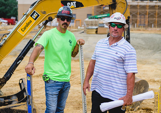 Jordan Snipes (left) credits Shannon Murrell, Construction Manager (right), for helping move the company into the concrete space in its early days.